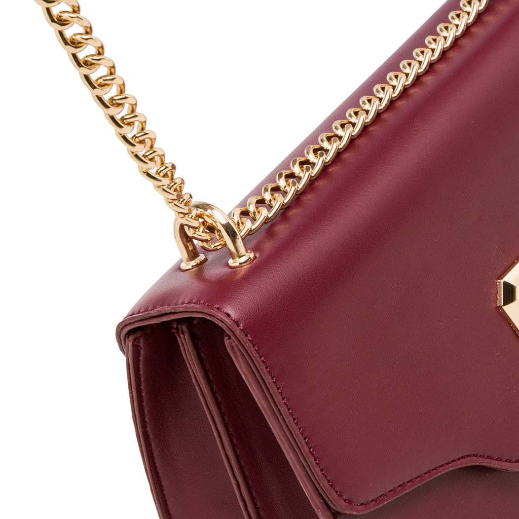 Borsa a tracolla da donna bordeaux con logo in metallo Lora Ferres