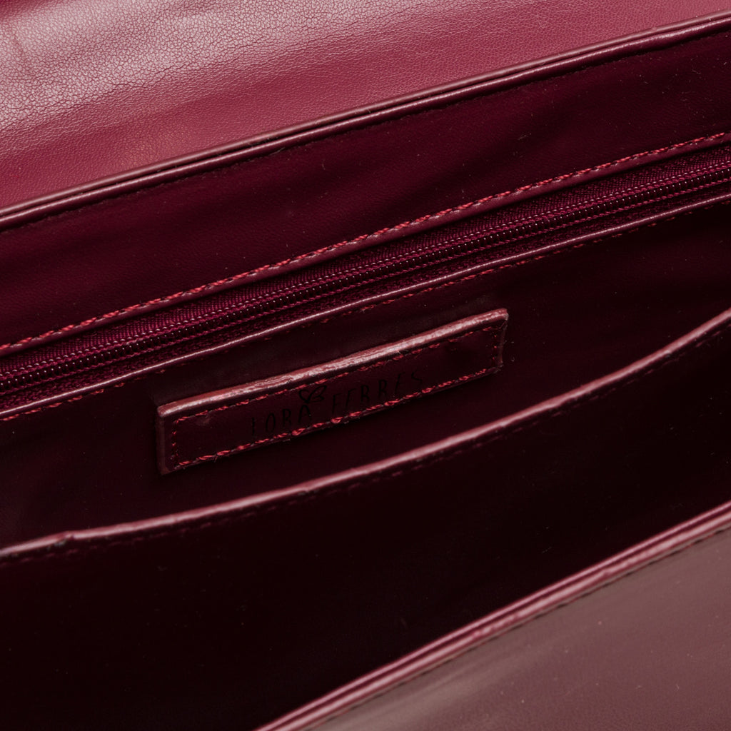 Borsa a tracolla da donna bordeaux con logo in metallo Lora Ferres