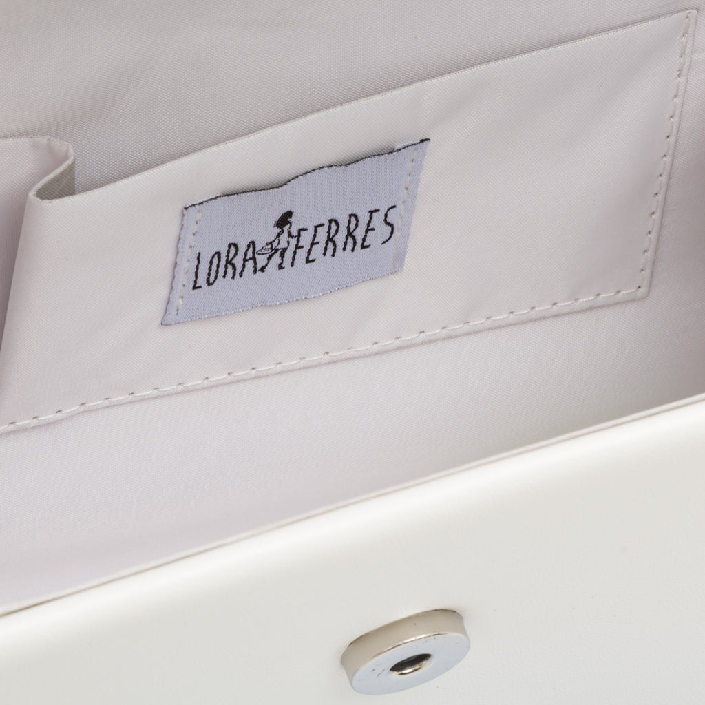 Borsetta da donna bianca con manico in metallo decorato con strass Lora Ferres