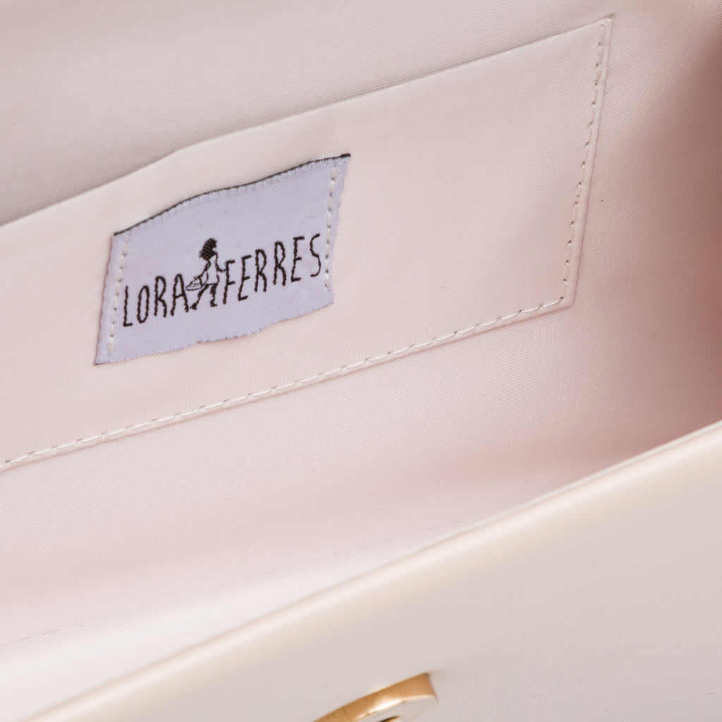 Borsetta da donna nude con manico in metallo decorato con strass Lora Ferres