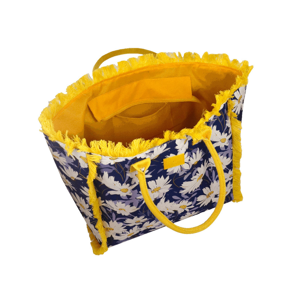 Borsa mare blu con fiori e frange gialle da Donna Camomilla Milano