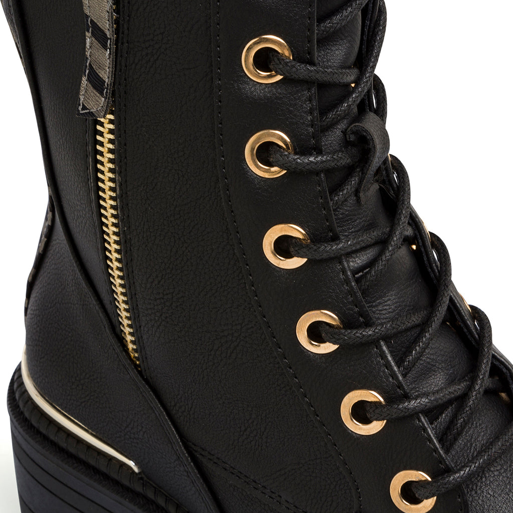 Anfibi neri da donna con suola chunky e zip Lora Ferres