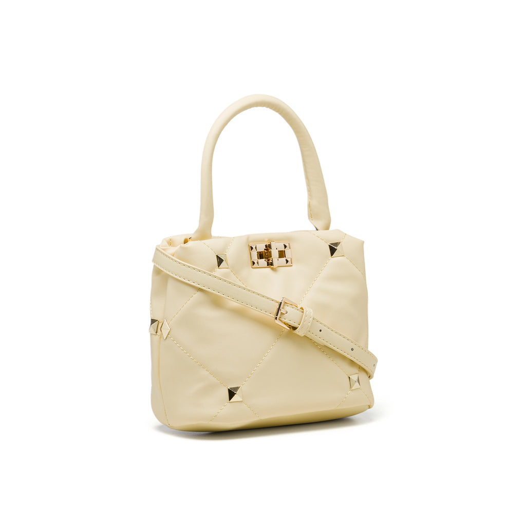 Borsa a mano gialla effetto trapuntato con borchie piramidali Lora Ferres