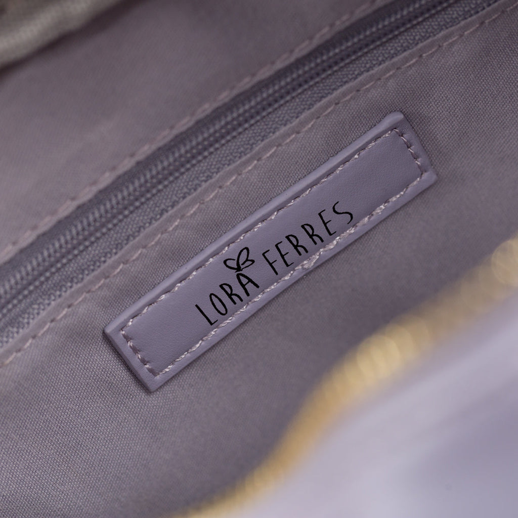 Borsa a tracolla lilla trapuntata da donna Lora Ferres