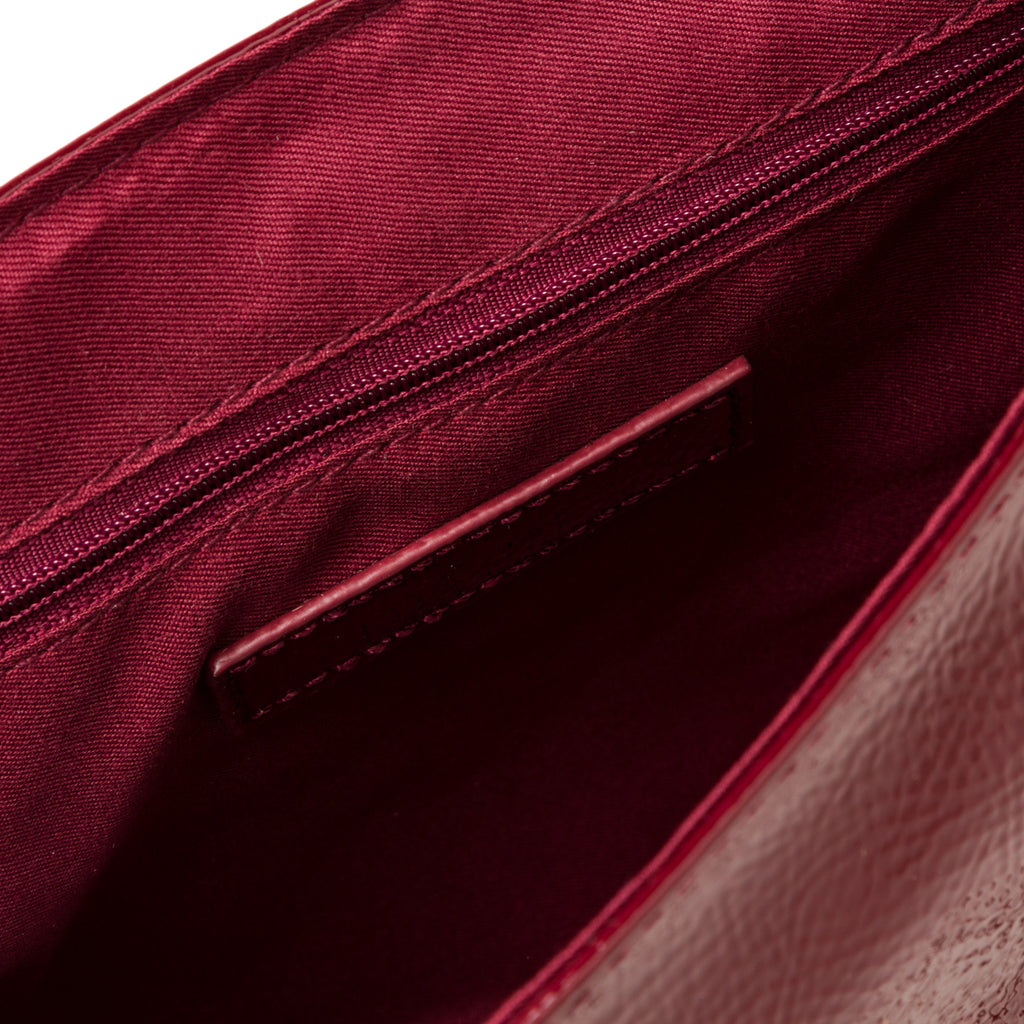 Borsa a tracolla bordeaux effetto lucido da donna con borchiette Lora Ferres