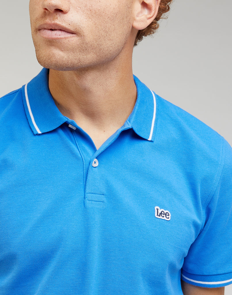 Polo azzurra da uomo con bordino a contrasto Lee